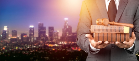 Lawyer with gavel judge on city backgroundの写真素材