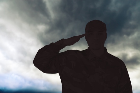 Young military soldier man silhouette on backgroundの写真素材