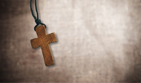 The cross on wooden tableの写真素材