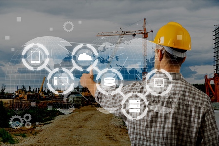 Man engineer on construction background