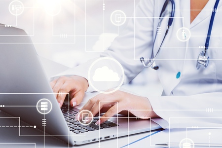 Medic woman working on laptopの写真素材