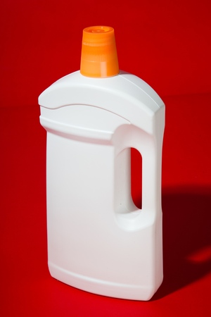 White Plastic Detergent Bottle on the Red Background