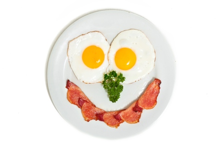 Eggs and bacon making a smiley faceの写真素材