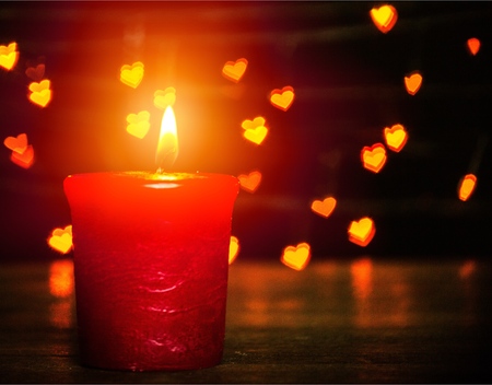 Golden light of candle flameの写真素材