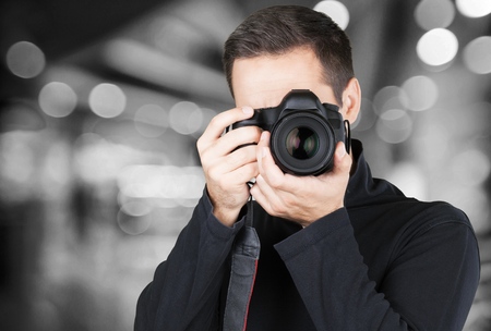 Male Photographer with Camera on backgroundの写真素材
