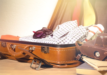 Travel bag on wooden floorの写真素材