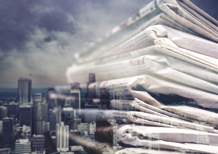 Pile of newspapers on white background