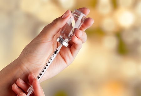 Human Hands with injection Syringeの写真素材