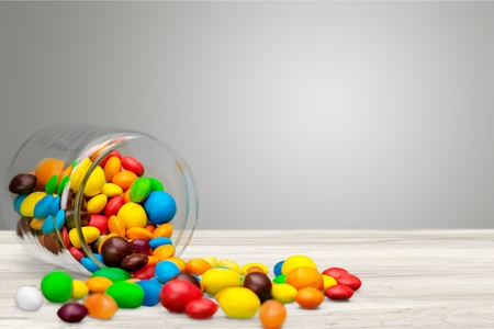 Colorful candies sweets falling outの写真素材