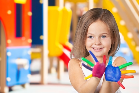 Cute little girl with painted handsの写真素材