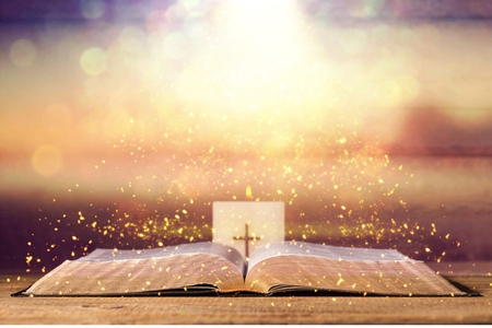 Open Holy bible book on background