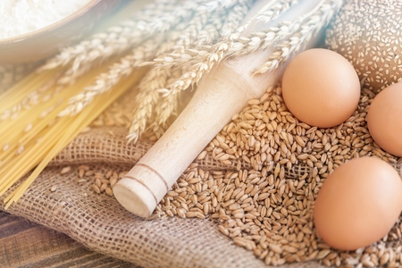 Wheat ears with egg and flour