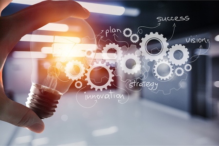 Hand holding light bulbの写真素材