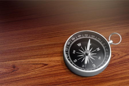 Compass on wooden tableの写真素材