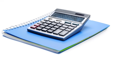 Calculator on top of a notebookの写真素材