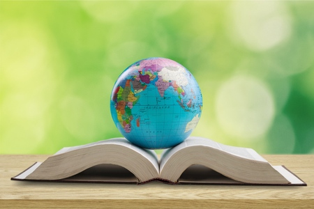 Ancient book and Earth globe