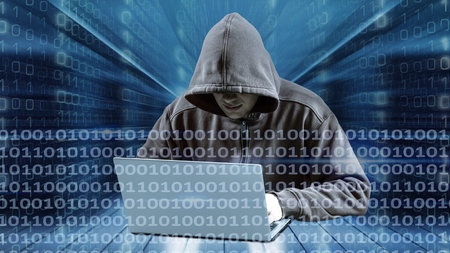 Hacker using laptop. Hacking the Internet.