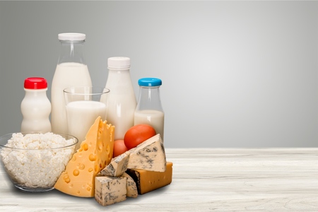 Dairy products collection on wooden deskの写真素材