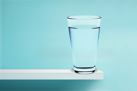 Glass of water on a tableの写真素材