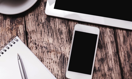 Smartphone with blank screen and earphones