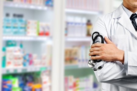 Portrait of doctor with arms crossedの写真素材