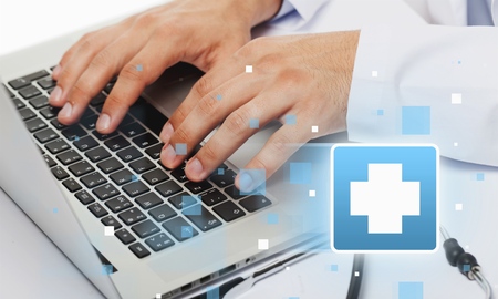Close-up Doctor at hospital working with tablet