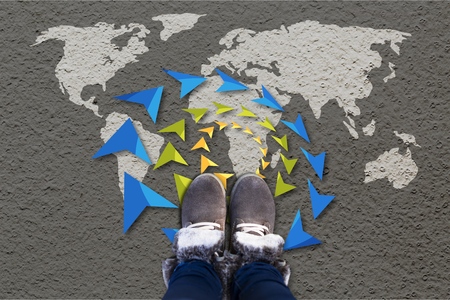 Grey fashion shoes on world map background