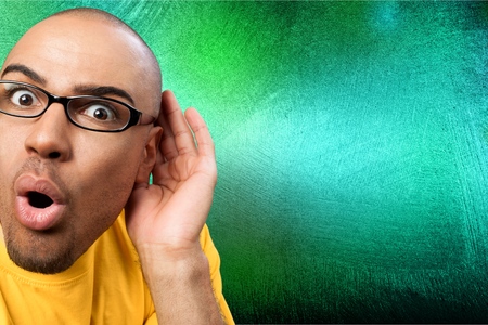 Listening handsome man wearing eyeglasses