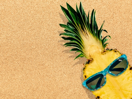 Pineapple wearing sunglasses - Summertime vacation holiday eating healthy conceptの写真素材