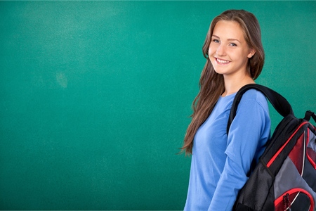 Pretty Young female student on background