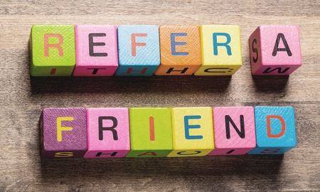 Refer a Friend text created with wooden cube