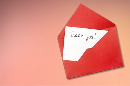 Blank card and envelope with thank you on backgroundの写真素材
