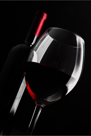 Pouring Red Wine into a Glassの写真素材