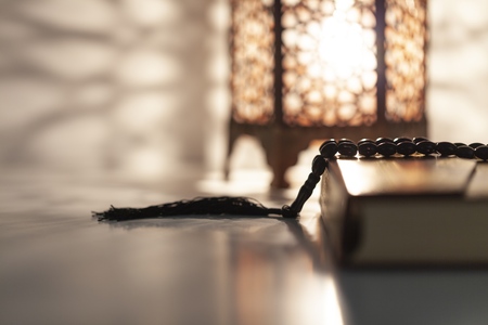 Ornamental Arabic lantern with burning candle glowingの写真素材