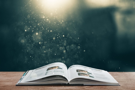 Open book on old wooden table