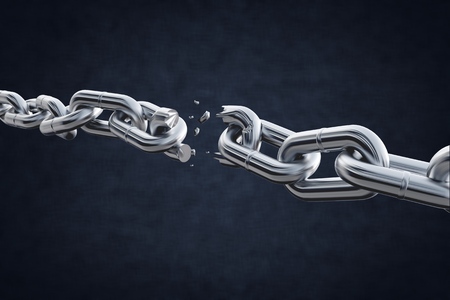 Broken metal chain on black backgroundの写真素材