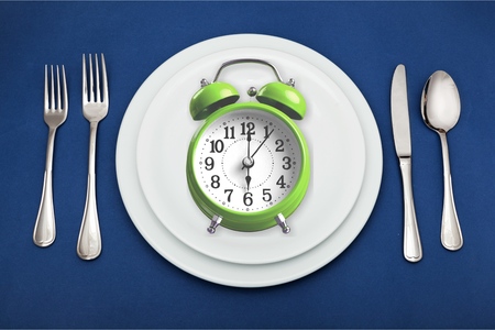 Intermittent fasting concept above breakfast clock delay