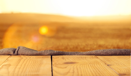 Worn table and blur with bokeh grass
