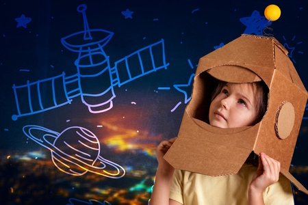 Beautiful girl dreamer about spaceの写真素材