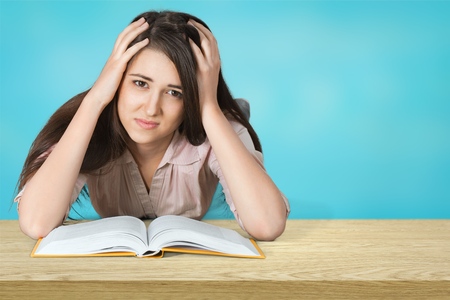 Tired Girl Read Difficult Book in Library