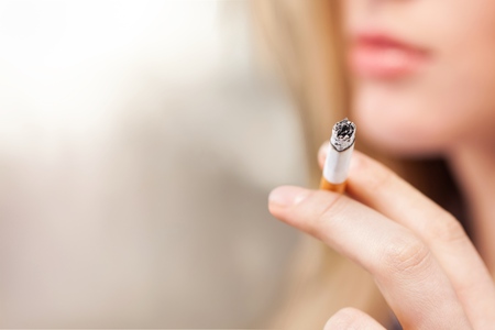 Portrait of the young elegant girl smokingの写真素材