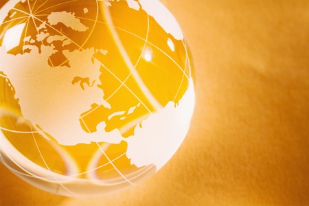 Glass globe ball on business report backgroundの写真素材