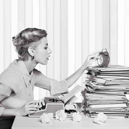 Smiling office worker showing thumb upの写真素材