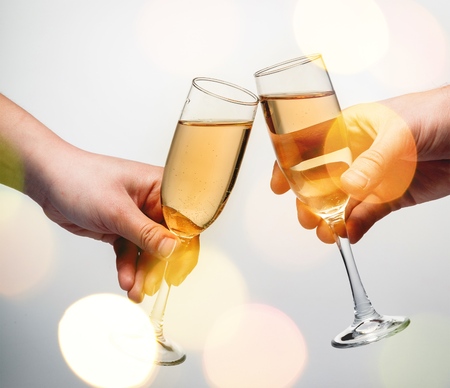 Hands toasting with Champagne on background