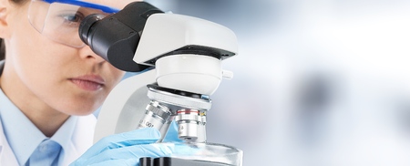 Scientist researcher using microscope in laboratory. Medical healthcare technology and...