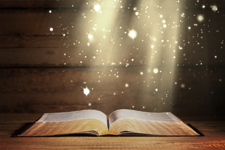 Open bible and black backgroundの写真素材