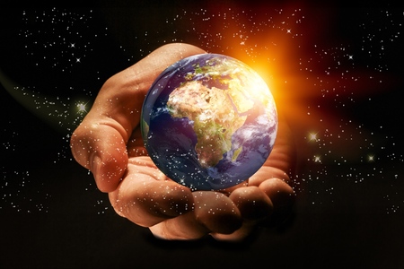 Earth at night was holding in human hands. Earth day. Energy saving concept, Elements of this image furnished byの写真素材