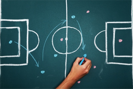 Soccer game plan on balckboardの写真素材
