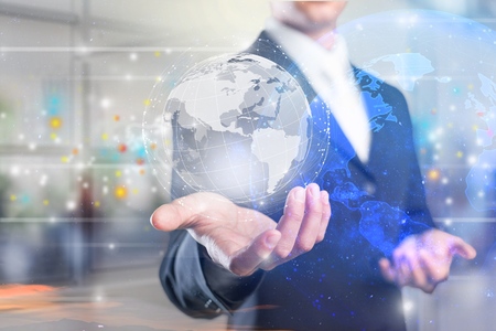 Businessman holding global network and data exchanges over the world 3D renderingの写真素材
