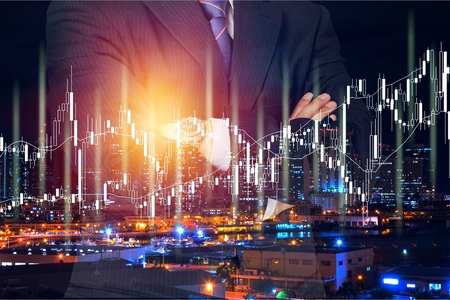 Stock market data on digital LED display. A daily market price and quotation of prices chart and candle stick tracking for Forex trading.の写真素材